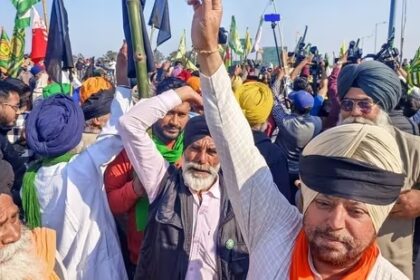 Farmers tying a black cloth on their turbans to ma 1708718776902 1709474732502